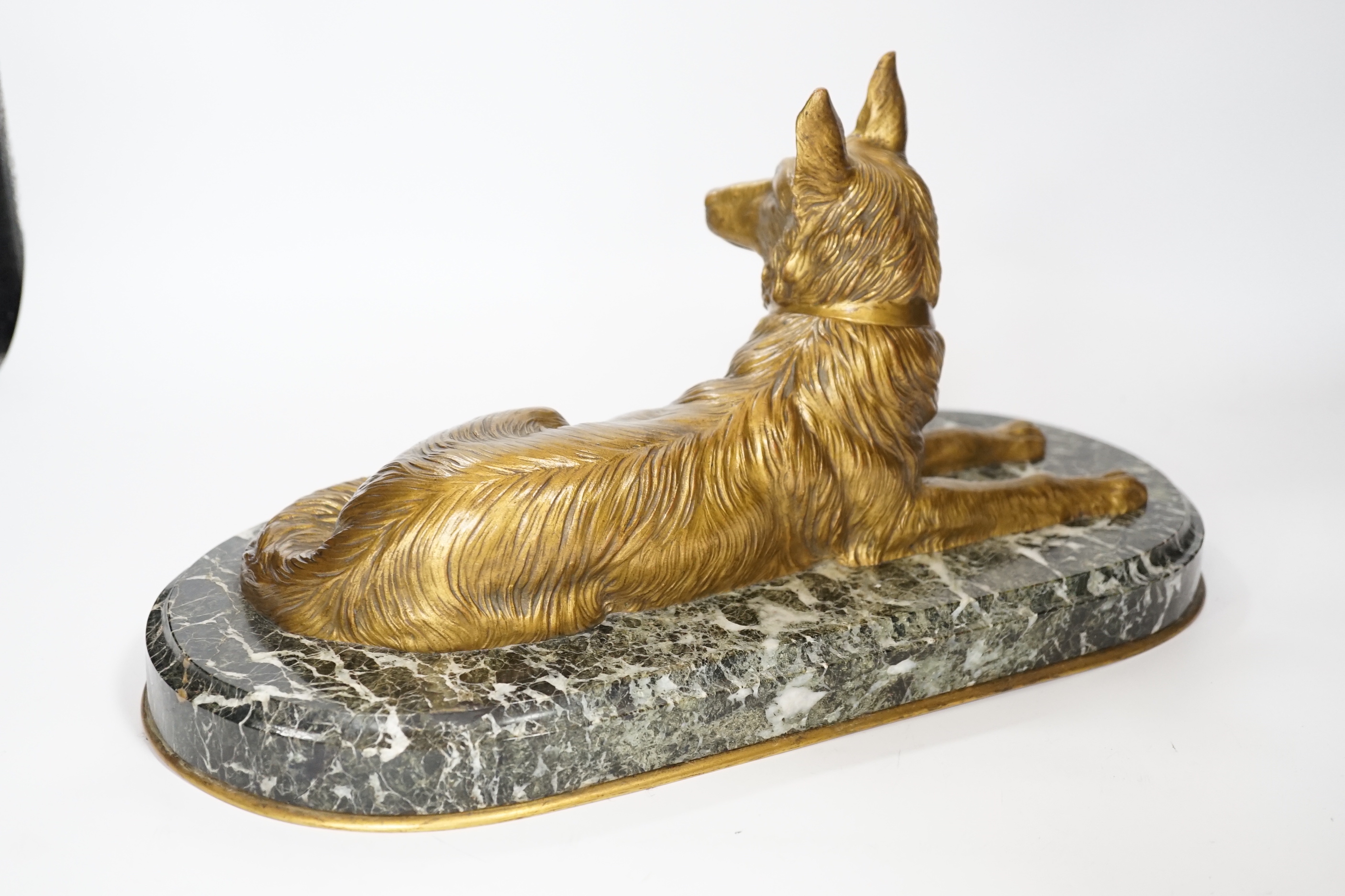 A recumbent dog gilt bronze on marble plinth, style of Chiparus, 40cm long